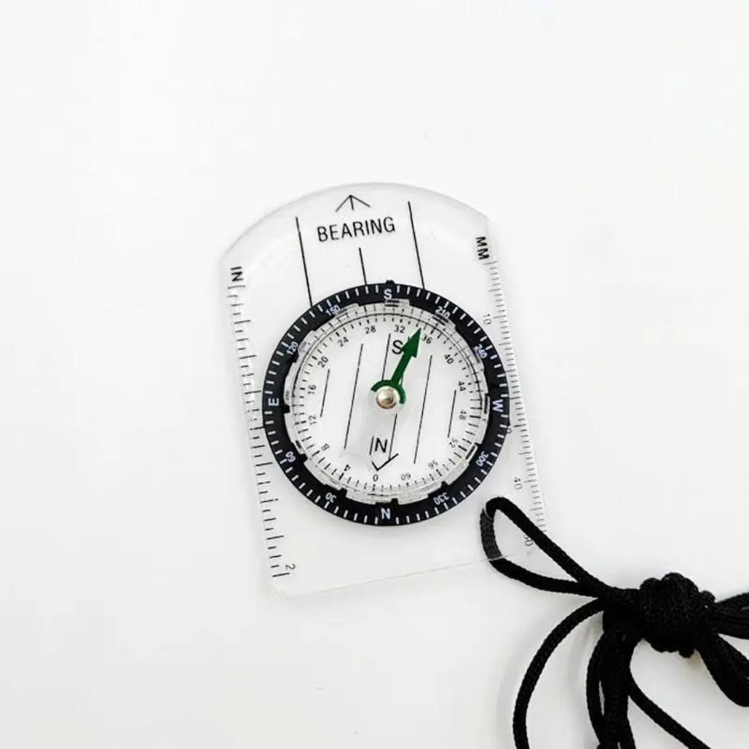Compass with a liquid-filled base