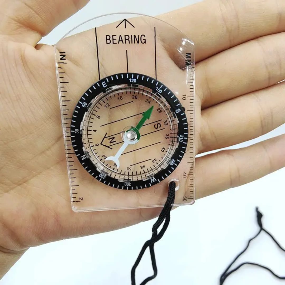 Compass with a liquid-filled base