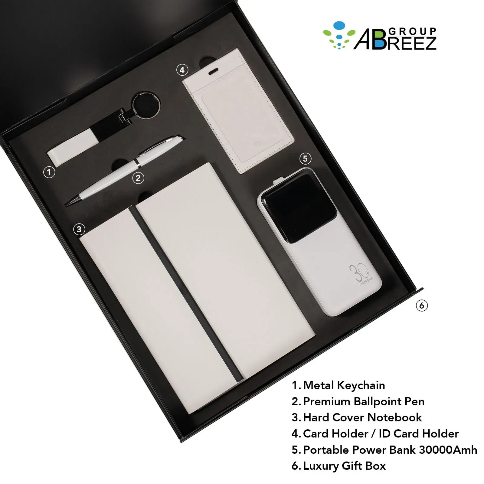 Premium corporate gift set featuring a branded notebook, pen, keychain, card holder, and power bank — White