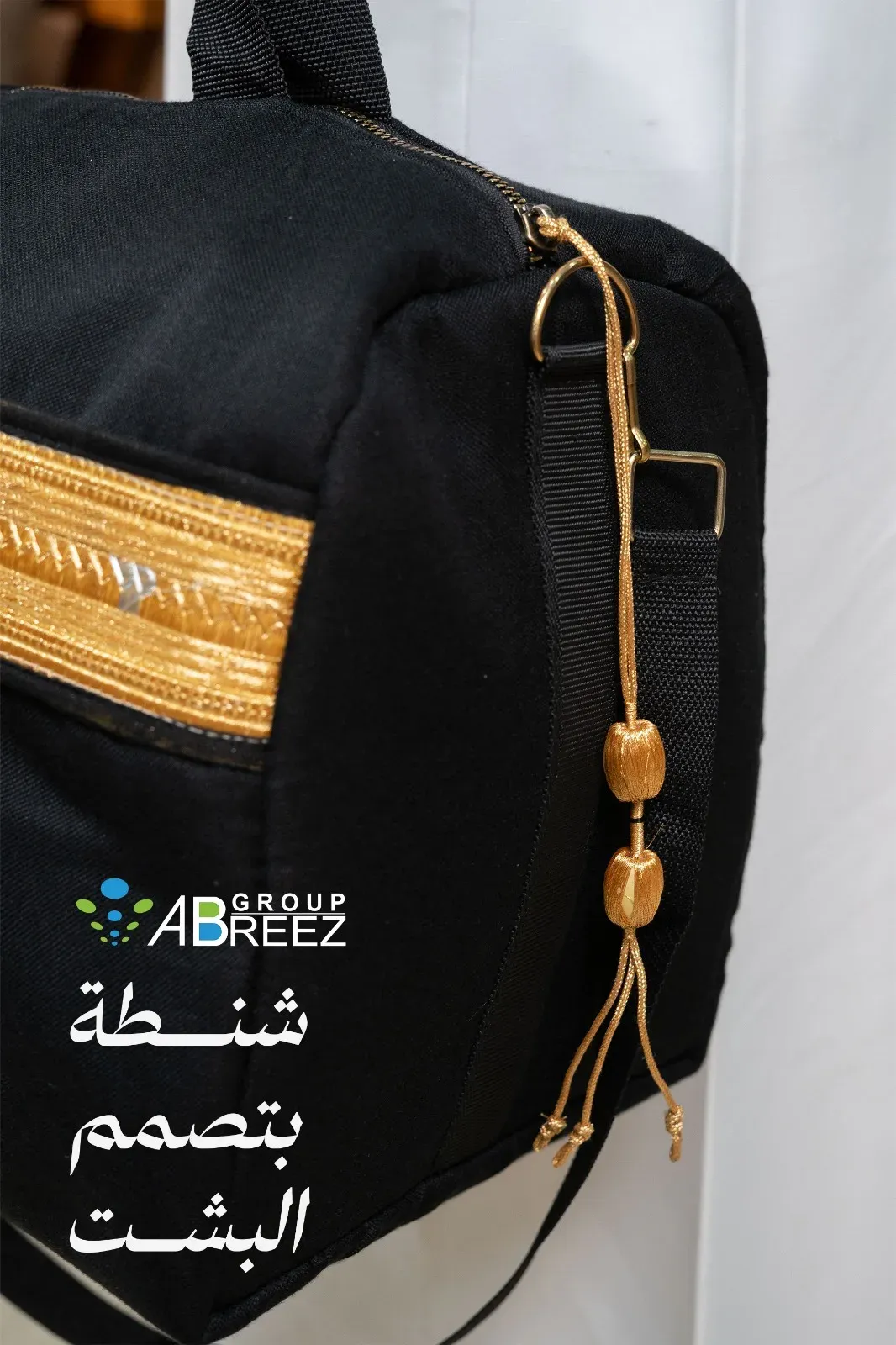 Black barrel bag inspired by the traditional Saudi Bisht, featuring iconic golden zari embroidery and tassel details — Big Black