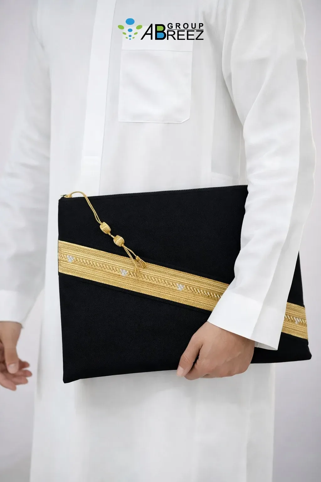 Black Saudi Bisht design pouch bag by Abreez Group, featuring gold zari embroidery and dimensions of 35 cm by 28 cm — Black