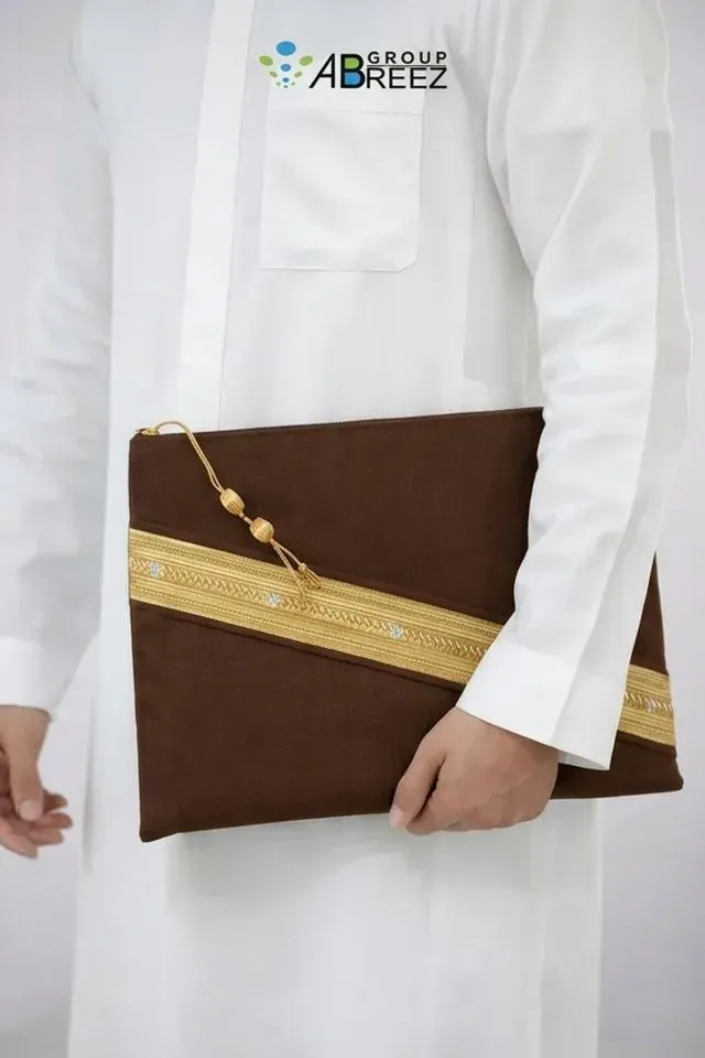 Black Saudi Bisht design pouch bag by Abreez Group, featuring gold zari embroidery and dimensions of 35 cm by 28 cm — Brown